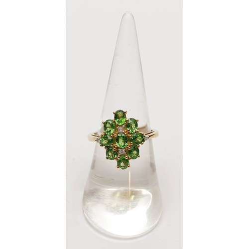 48 - A hallmarked 9ct gold tsavorite and diamond cluster ring, size N/O, gross weight 4.2g. UK shipping £... 