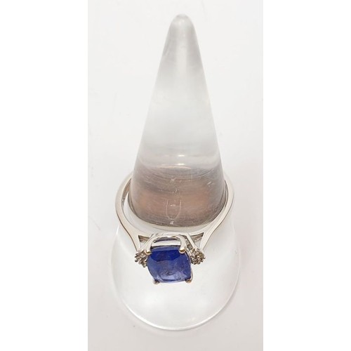 52 - A hallmarked 9ct gold ring set with tanzanite and white zircon, size Q, gross weight 2.8g. UK shippi... 