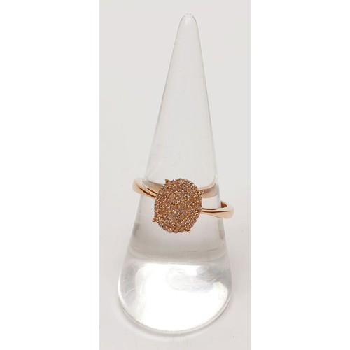 55 - A hallmarked 9ct rose gold diamond cluster ring, size Q, weight 2.1g. UK shipping £14.