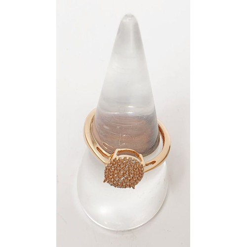 55 - A hallmarked 9ct rose gold diamond cluster ring, size Q, weight 2.1g. UK shipping £14.