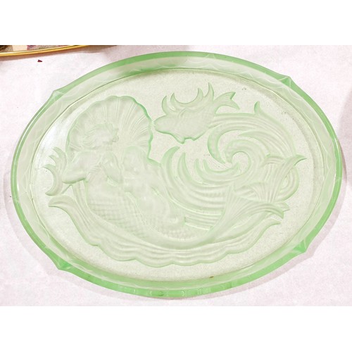 69 - A 1920s uranium glass dressing table tray with an intaglio scene of a merman and mermaid. No shippin... 