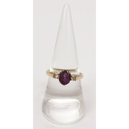 21 - A hallmarked 18ct gold ring set with an amethyst and two diamonds, size P/Q, gross weight 3.1g. UK s... 