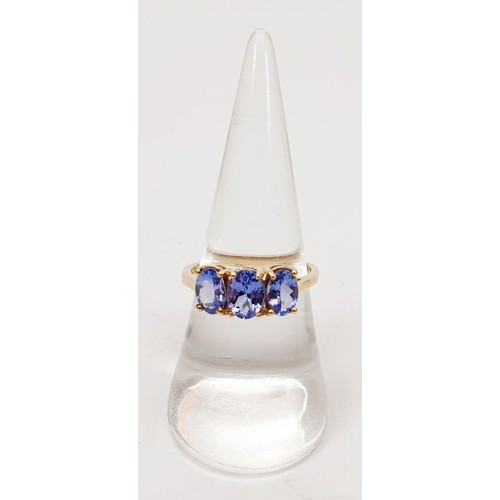 27 - A hallmarked 9ct gold ring set with tanzanite, size O, gross weight 2.1g. UK shipping £14.