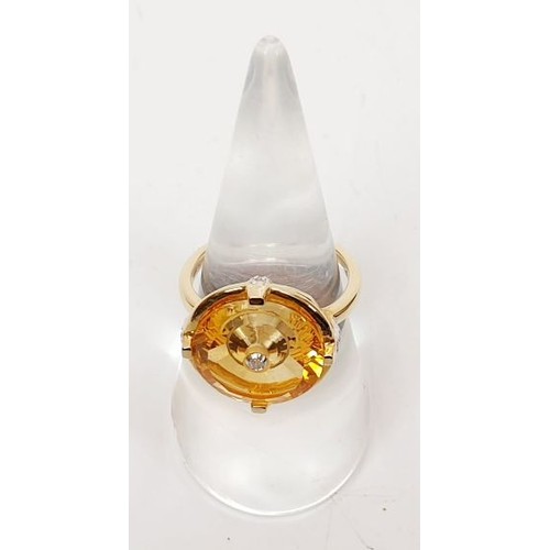 36 - A hallmarked 9ct gold ring set with citrine and diamond, size N/O, gross weight 4.5g. UK shipping £1... 