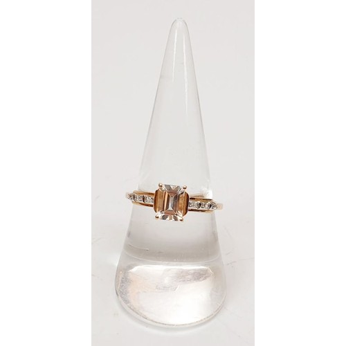 40 - A hallmarked 9ct rose gold ring set with danberite and white zircon, size P/Q, gross weight 2.1g. UK... 