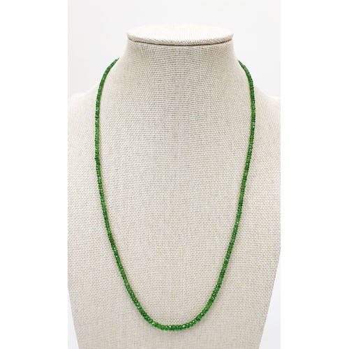 3 - An emerald bead necklace with 9ct gold fittings. UK shipping £14.