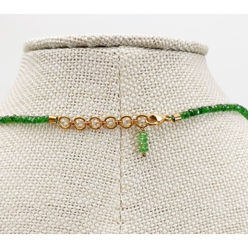 3 - An emerald bead necklace with 9ct gold fittings. UK shipping £14.