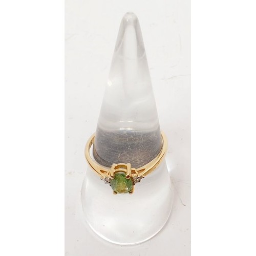 8 - A hallmarked 9ct gold ring set with demantoid garnet and diamond, size Q, gross weight 1.8g. UK ship... 