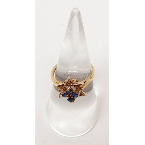 23 - A 1970s hallmarked 9ct gold ring set with sapphires, size L, gross weight 2.4g. UK shipping £14.