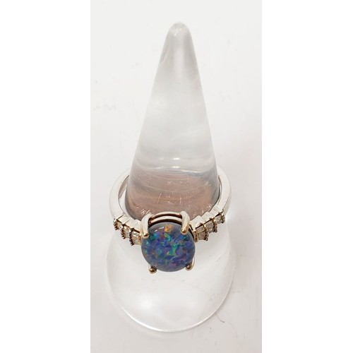 32 - A 925 silver ring with platinum overlay set with bolder opal and diamond, size P/Q. UK shipping £14.