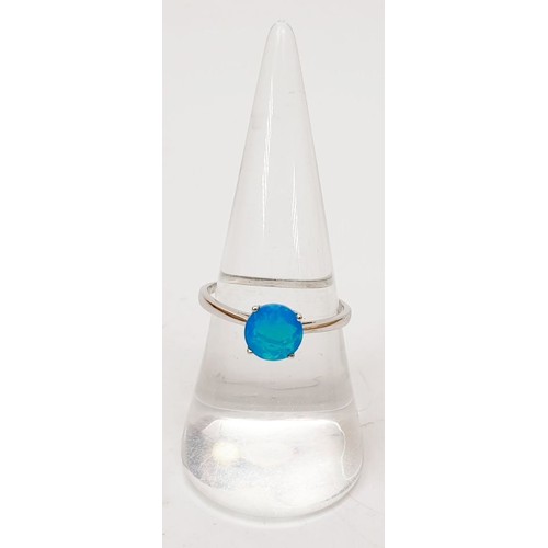 38 - A 925 silver ring set with Paraiba blue opal, size P/Q. UK shipping £14.