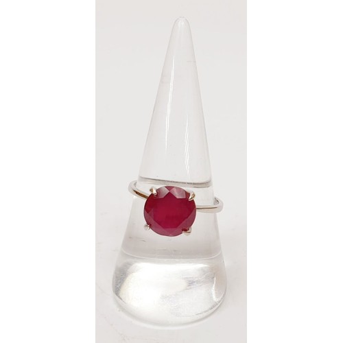 39 - A 925 silver ring set with a treated Thai ruby, size P/Q. UK shipping £14.