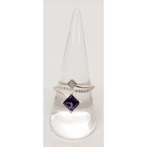 40 - A 925 silver ring set with white and purple stones, size Q/R. UK shipping £14.