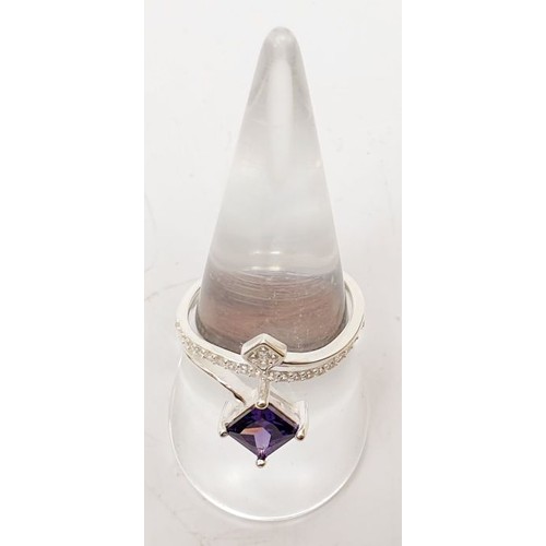 40 - A 925 silver ring set with white and purple stones, size Q/R. UK shipping £14.