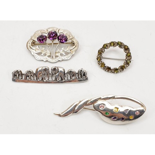 61 - Four silver brooches including elephants, gross weight 24g. UK shipping £14.