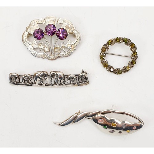 61 - Four silver brooches including elephants, gross weight 24g. UK shipping £14.