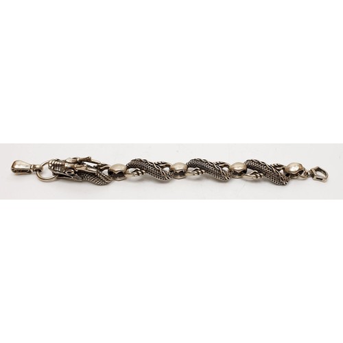 62 - A 925 silver dragon bracelet, weight 36g. UK shipping £14.