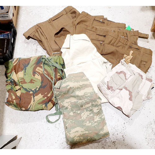 184 - A box of military clothing. UK shipping £14.