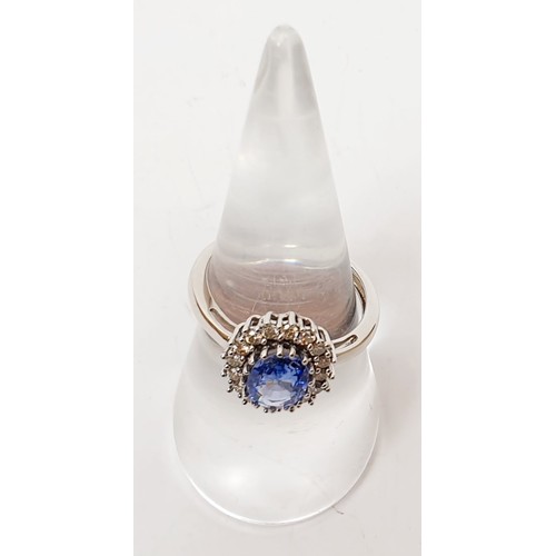 19 - A hallmarked 9ct white gold Ceylon sapphire and diamond cluster ring, size O, gross weight 2.7g. UK ... 