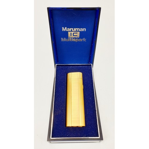 73 - A vintage boxed Maruman Multi-spark cigarette lighter. UK shipping £14.