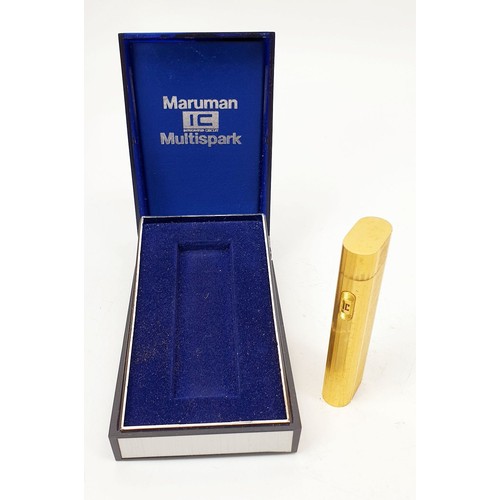 73 - A vintage boxed Maruman Multi-spark cigarette lighter. UK shipping £14.