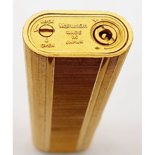 73 - A vintage boxed Maruman Multi-spark cigarette lighter. UK shipping £14.