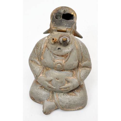 74 - A vintage Austrian spelter cigarette table lighter in the form of a Budai, height 4