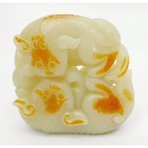 75 - A Chinese rustic jade carving modelled as two cats with a ball, width 3