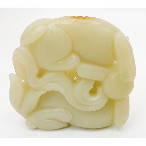 75 - A Chinese rustic jade carving modelled as two cats with a ball, width 3