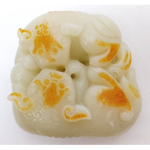 75 - A Chinese rustic jade carving modelled as two cats with a ball, width 3