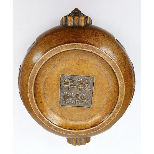 77 - A Chinese bronze censor decorated with Lotus flowers and mass candles, marks to the base, diameter 4... 