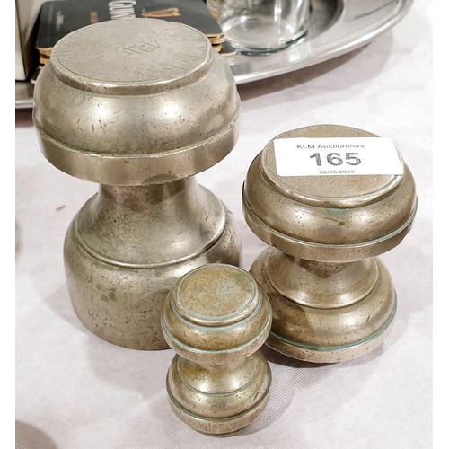 165 - Three nickel plated brass postal weights. UK shipping £14.