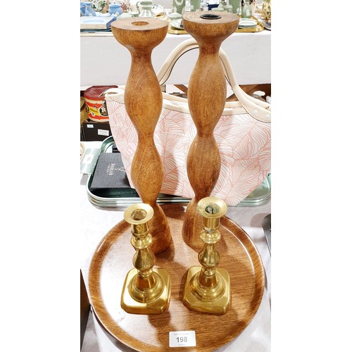 198 - A pair of wooden candlesticks, height 15.2