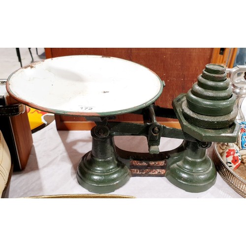 172 - A set of cast iron scales and weights. UK shipping £14.