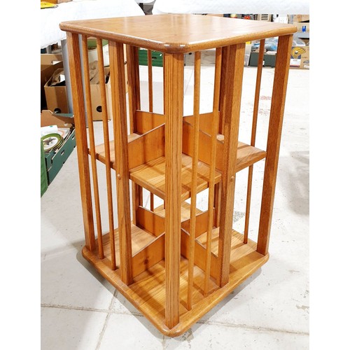 217 - An oak revolving bookcase, height 29.5