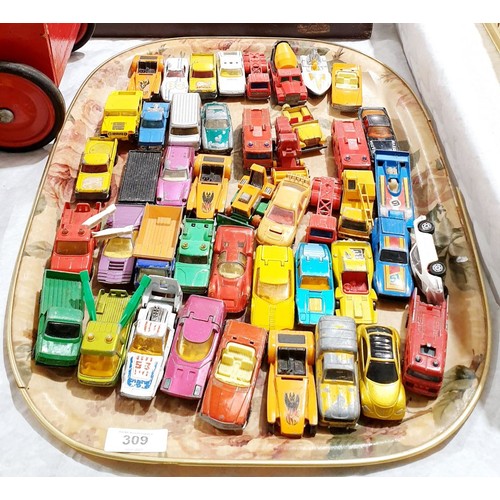 309 - A selection of toy cars. UK shipping £14.