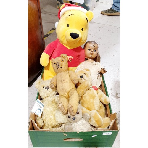 317 - A box of soft toys and a doll including a vintage limb articulated straw filled teddy bear, length 1... 