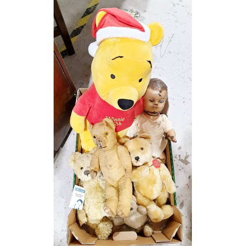 317 - A box of soft toys and a doll including a vintage limb articulated straw filled teddy bear, length 1... 