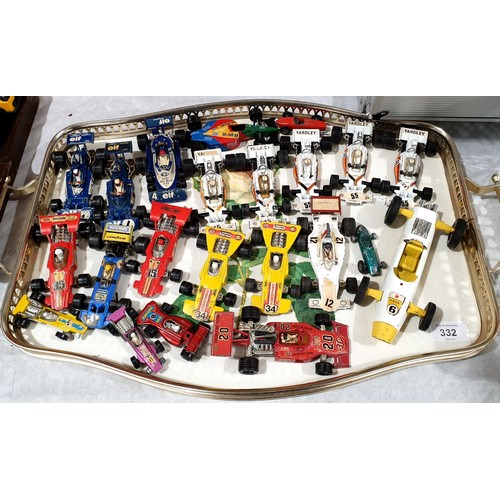 332 - A selection of toy racing cars. UK shipping £14.