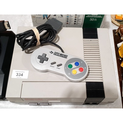 334 - A Nintendo NES Mattel version A/F, together with a SNES controller. Electricals are sold as scrap. U... 