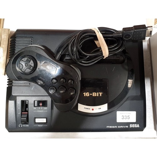 335 - A Sega Megadrive together with a Sega Saturn controller. Electricals are sold as scrap. UK shipping ... 