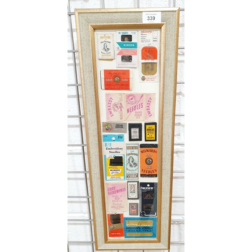 339 - A framed display of vintage needle packets, 21.5