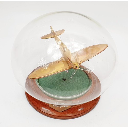 347 - A Nothumbrian Glass model of a Spitfire in a dome, height 5.5