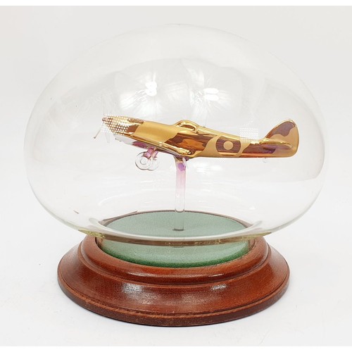 347 - A Nothumbrian Glass model of a Spitfire in a dome, height 5.5