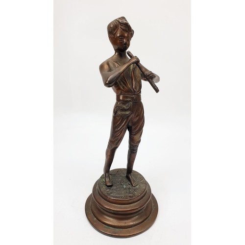 348 - A vintage bronzed spelter figure of a boy with a penny whistle, height 9.5