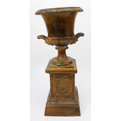 349 - A brass vase on a classical base, height 13.25