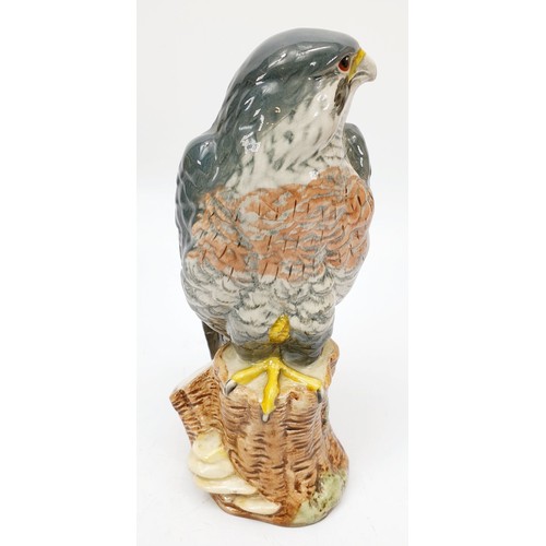 353 - Royal Doulton for Whyte and Mackay, a decanter in the form of a peregrine falcon modelled by John G.... 