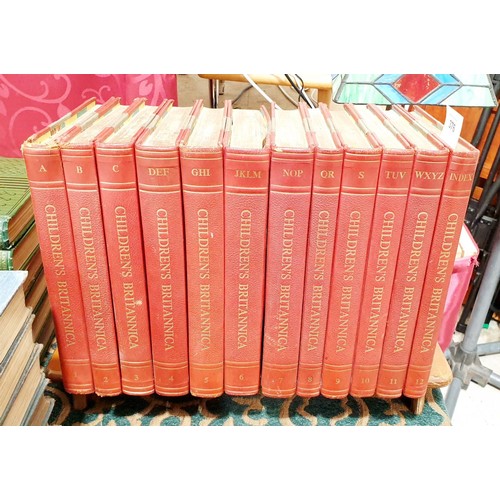 376 - The Children's Britannica in 12 volumes in a wooden book trough. No shipping. Arrange collection or ... 