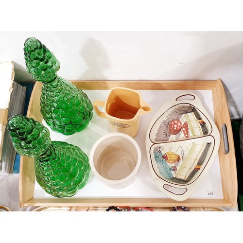 409 - A tray of glass and china including two green decanters. No shipping. Arrange collection or your own... 