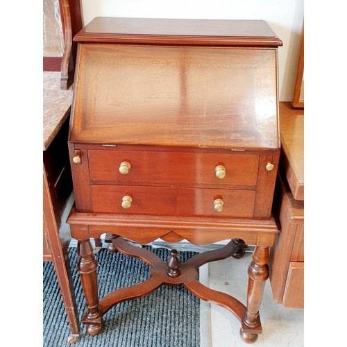 419 - A mahogany bureau with pigeon hole interior and two drawers under, height 38